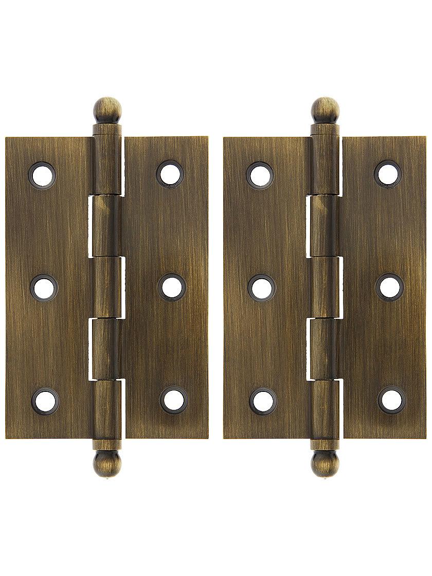 Pair of Solid Brass Ball-Tip Cabinet Hinges - 2 1/2 inch x 1 3/4 inch in Antique Brass.